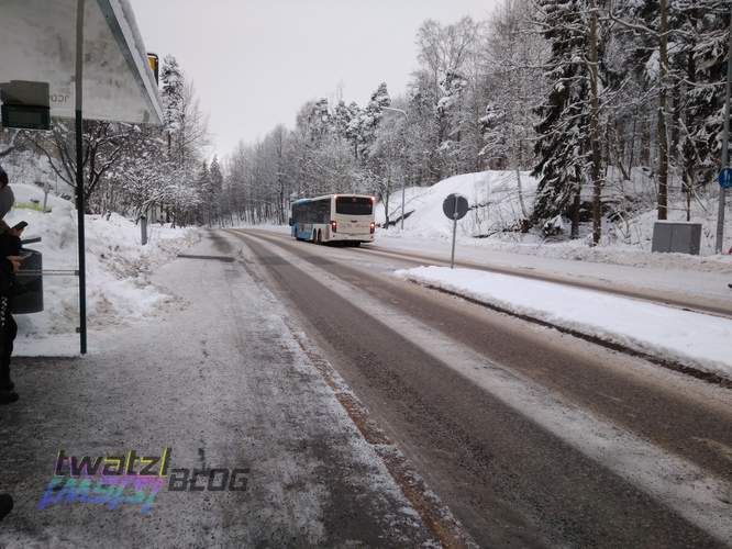 A bus leaving in the other direction.